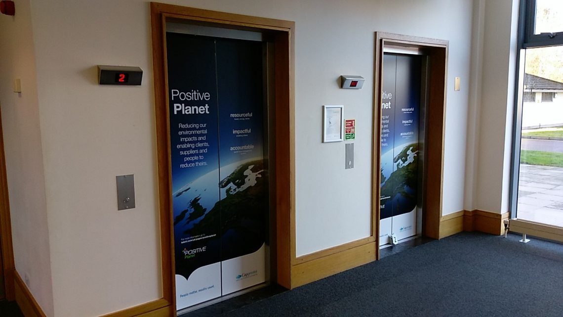 Lift in office with graphics on it