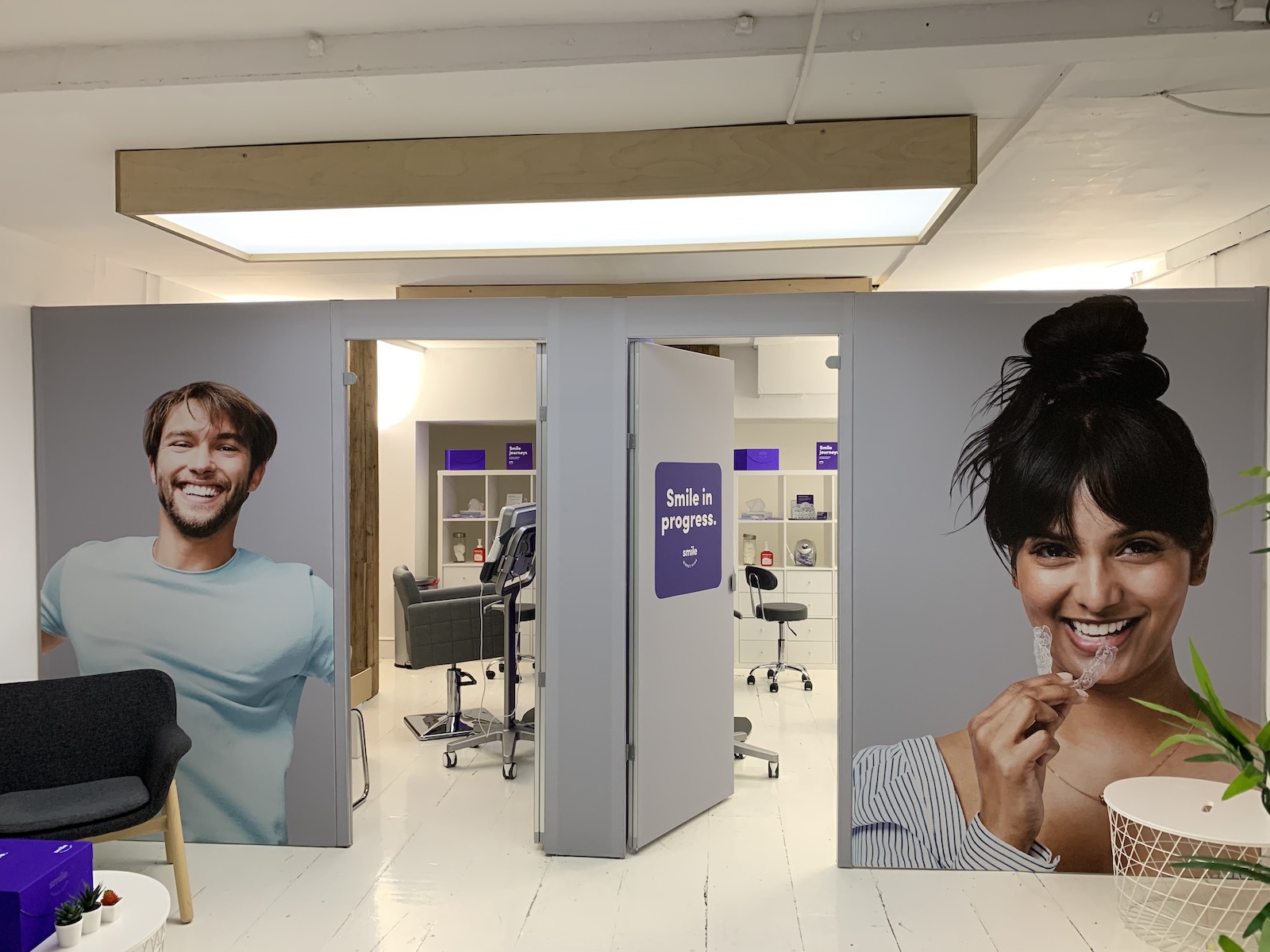 tension fabric frames with smiling people printed on